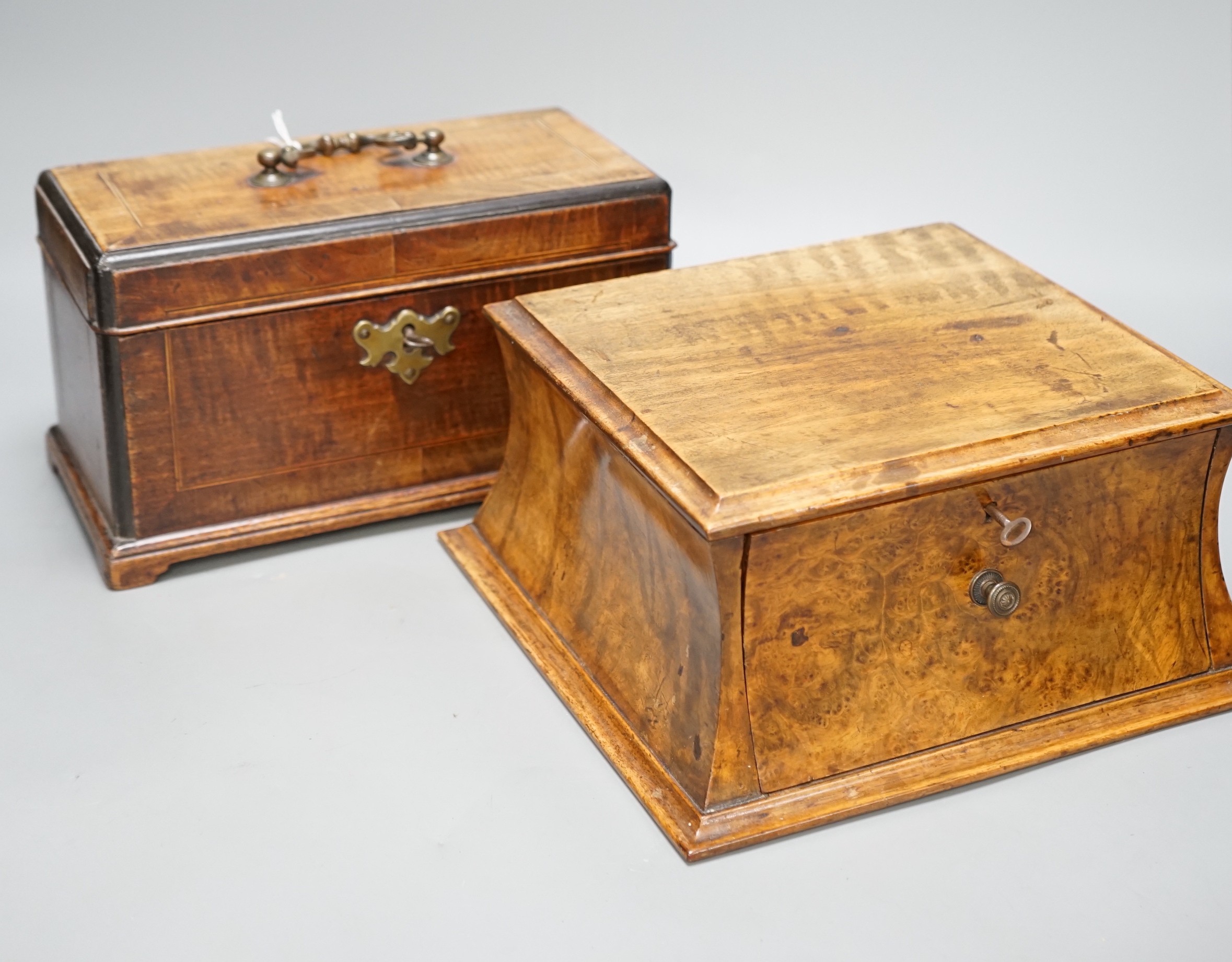 A George III mahogany tea caddy with inlaid decoration, together with a burr walnut veneer cavetto stationery box, both with keys